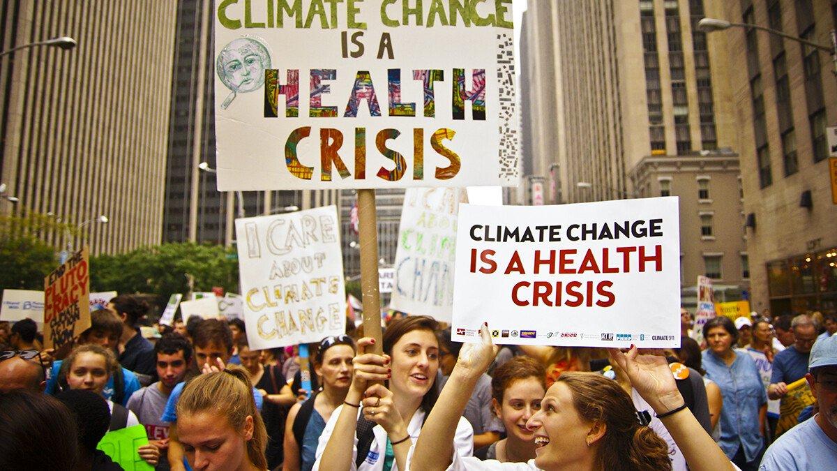 People holding placards on a demonstration about climate change