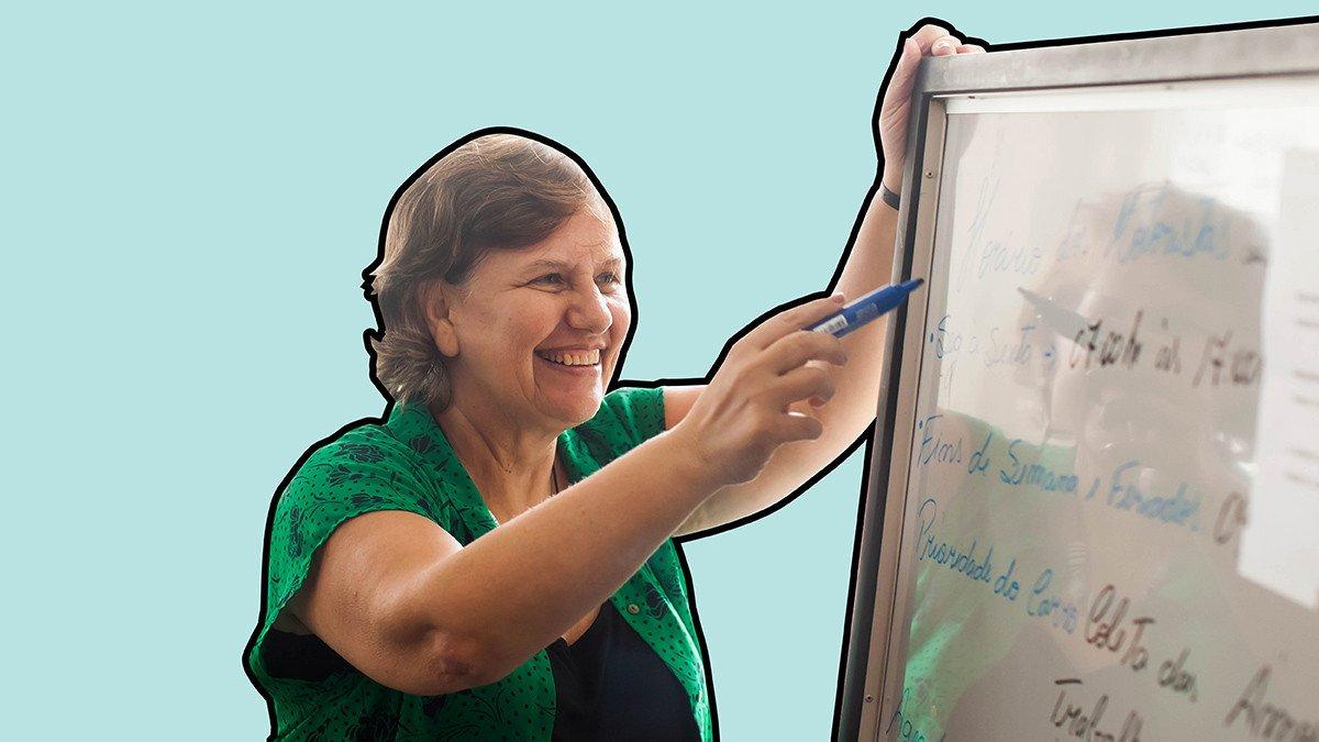 Female researcher writes on whiteboard